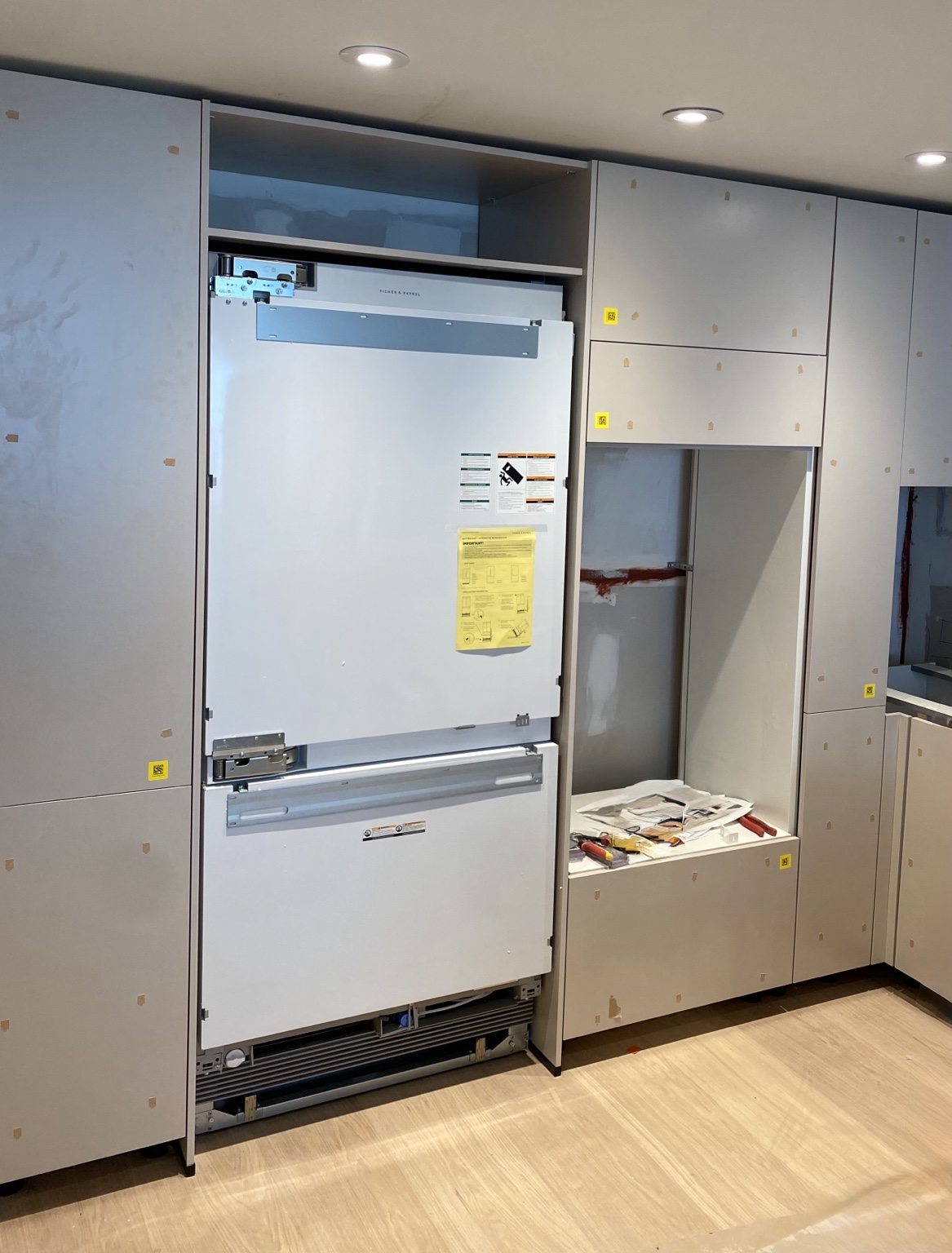 Fisher & Paykel panel-ready refrigerator installation in custom cabinetry