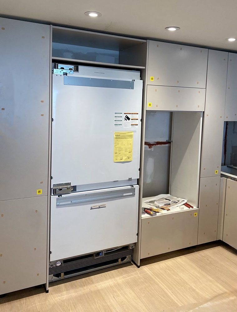 Fisher & Paykel panel-ready refrigerator installation in custom cabinetry