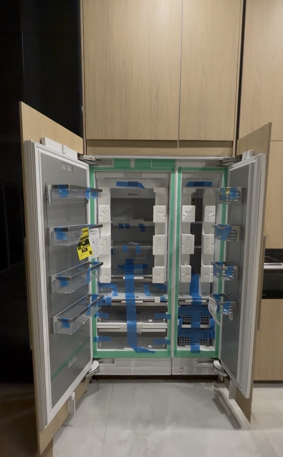 Open panel-ready refrigerator with custom cabinet doors